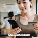 SOCIAL IMAGE PARTNER OFFERS TERMS APPLY woman managing online banking with smartphone and making mobile payment with credit card d3sign 19
